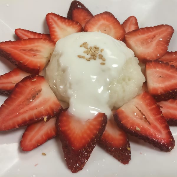 Strawberry sticky rice with coconut milk and sesame seeds, a Thai dessert from Tasty Thai Cuisine.